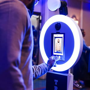 A guest approving their custom trading card on the trading card photo booth