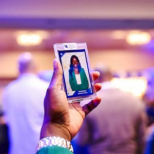 A woman looking at her custom trading card