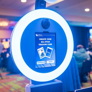 The custom UI of the trading card photo booth with a "guest" or "graduate" option