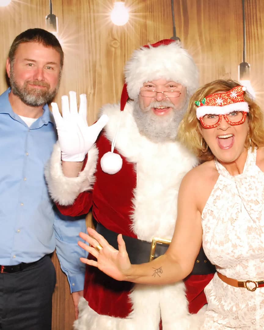 Photo of guests posing with Santa Claus on a Holiday Photo Booth